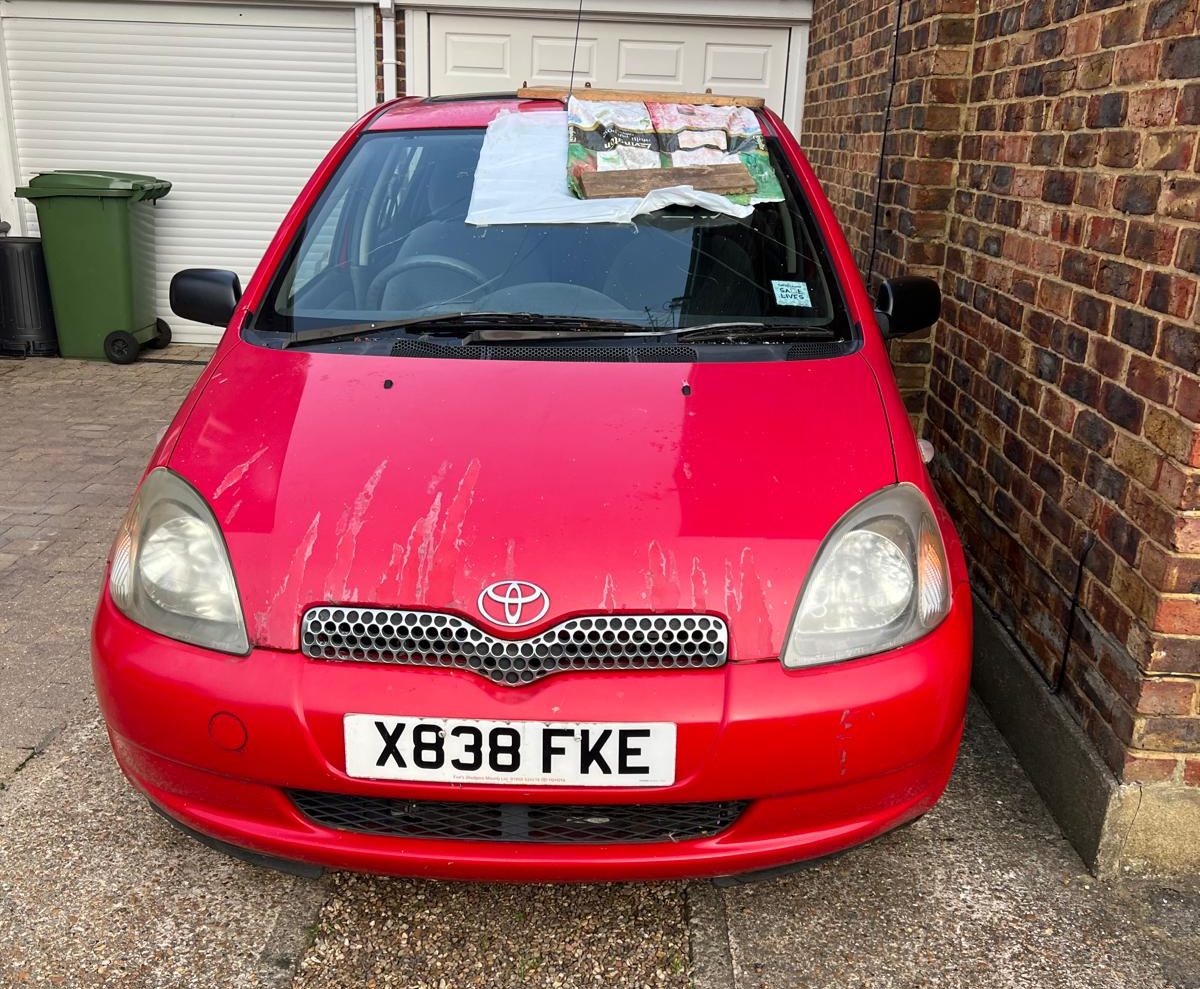 red Toyota Yaris getting a new windscreen fitted in chatham