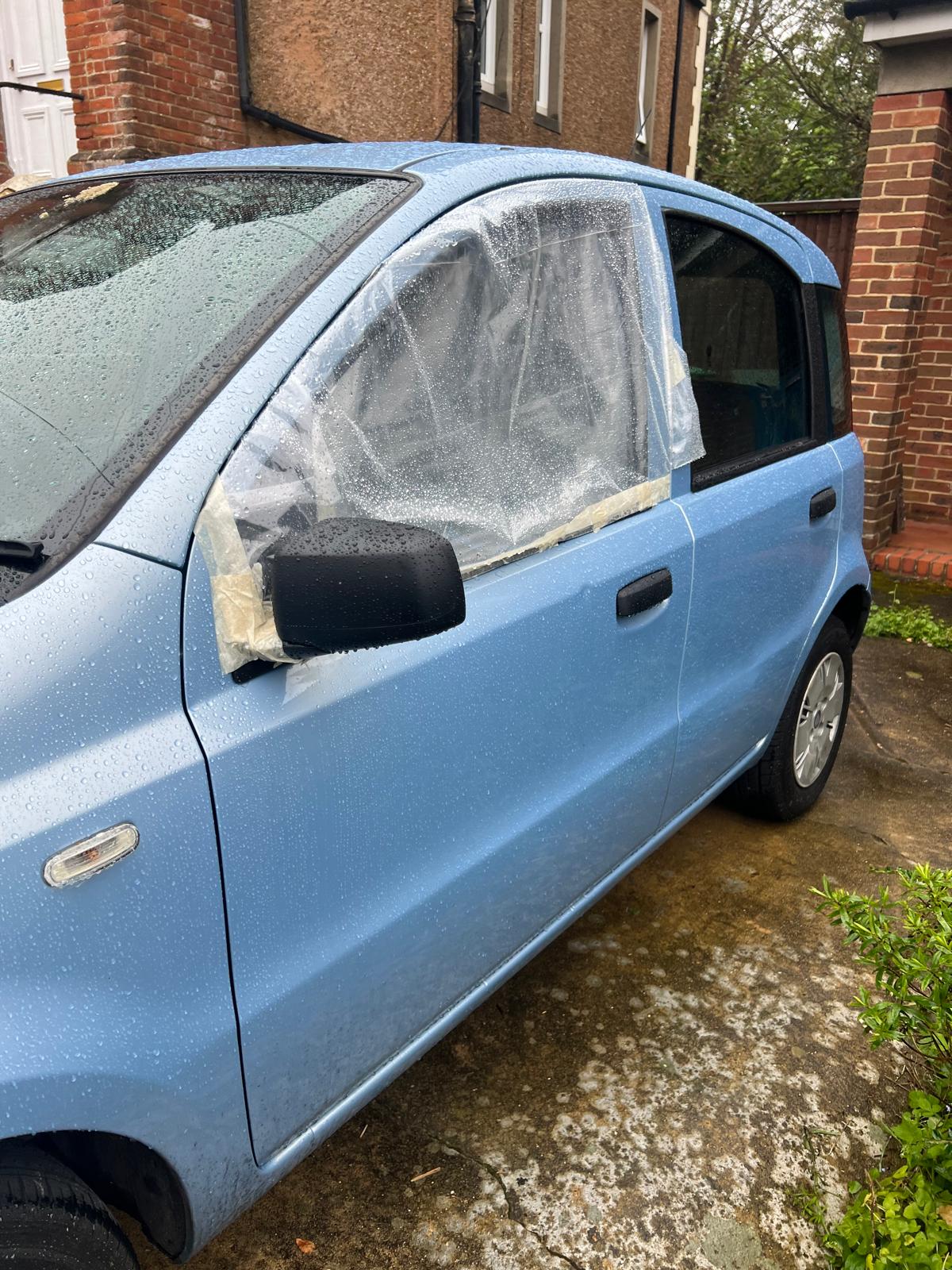 a sky blue car with a broken window being repaired by The Screensavers