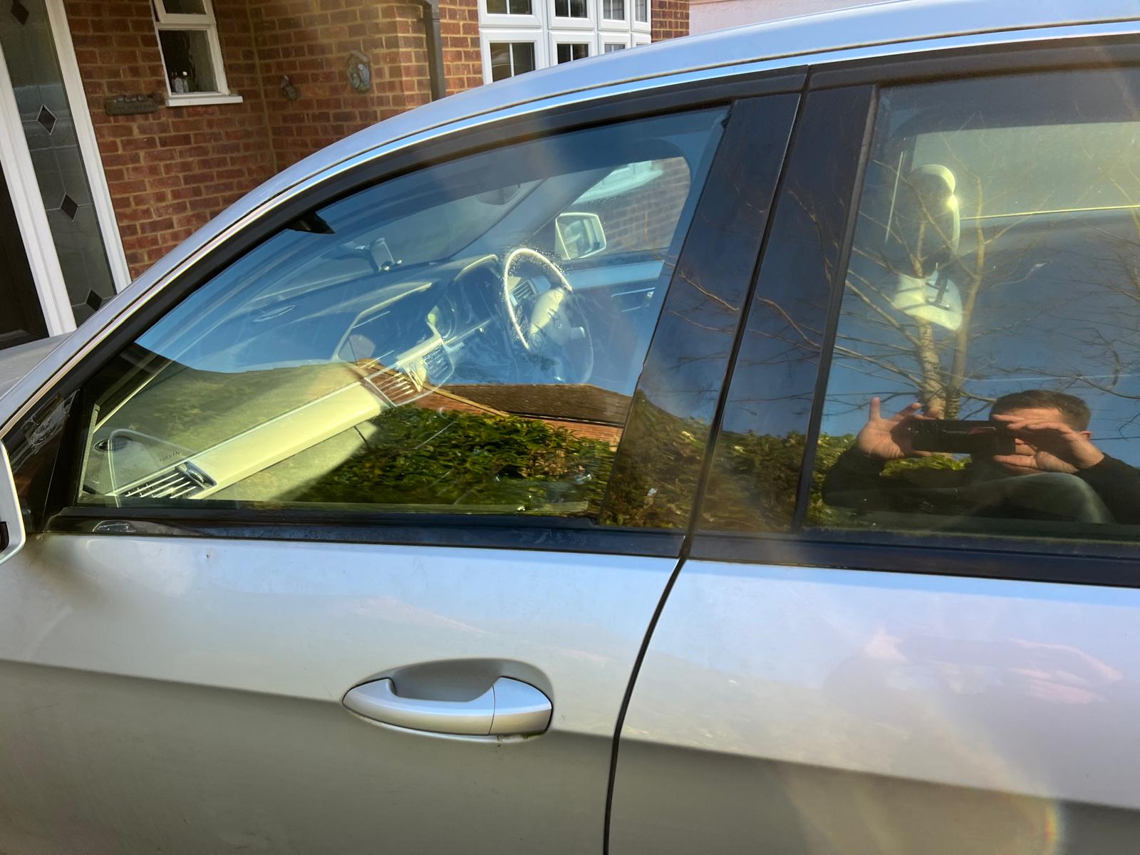 side window of a domestic silver car